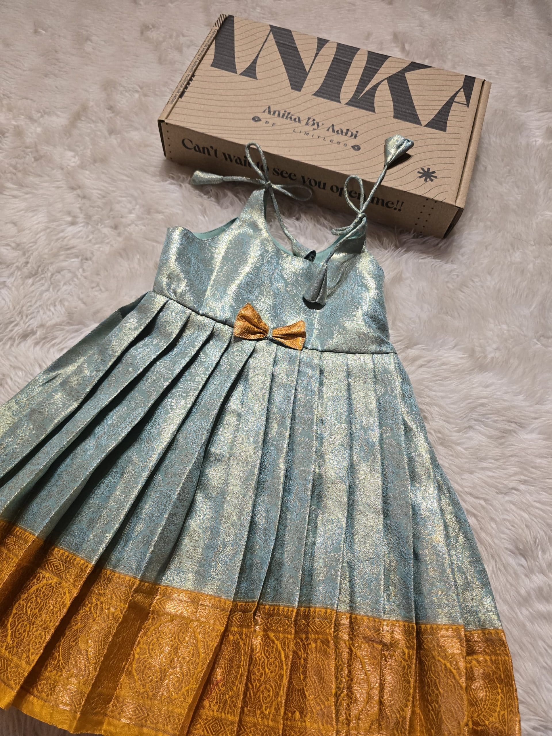 SWAYAM KIDS FROCK-TEAL ICEBLUE WITH MUSTARD YELLOW SMALL BORDER