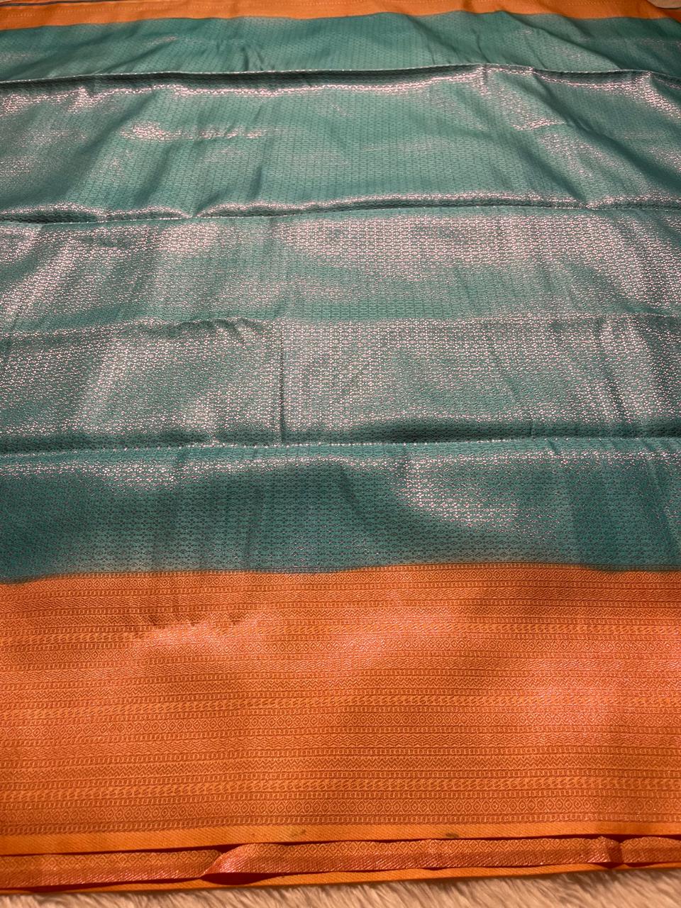 NINU-SKYBLUE WITH ORANGE SAREE