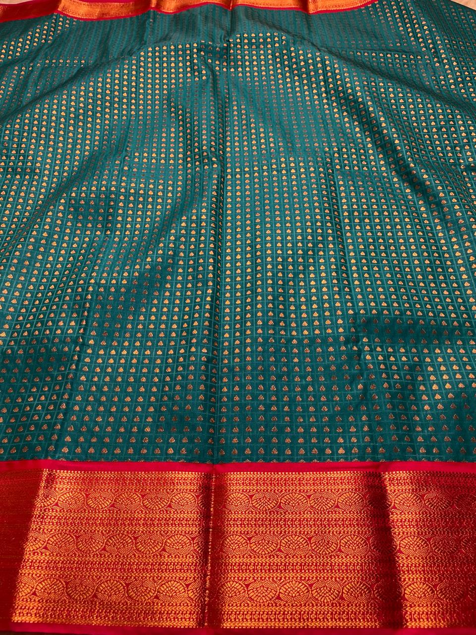 1000 BUTTAS-PEACOCK GREEN WITH PINK SAREE
