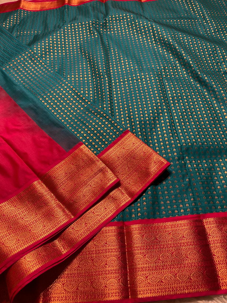 1000 BUTTAS-PEACOCK GREEN WITH PINK SAREE