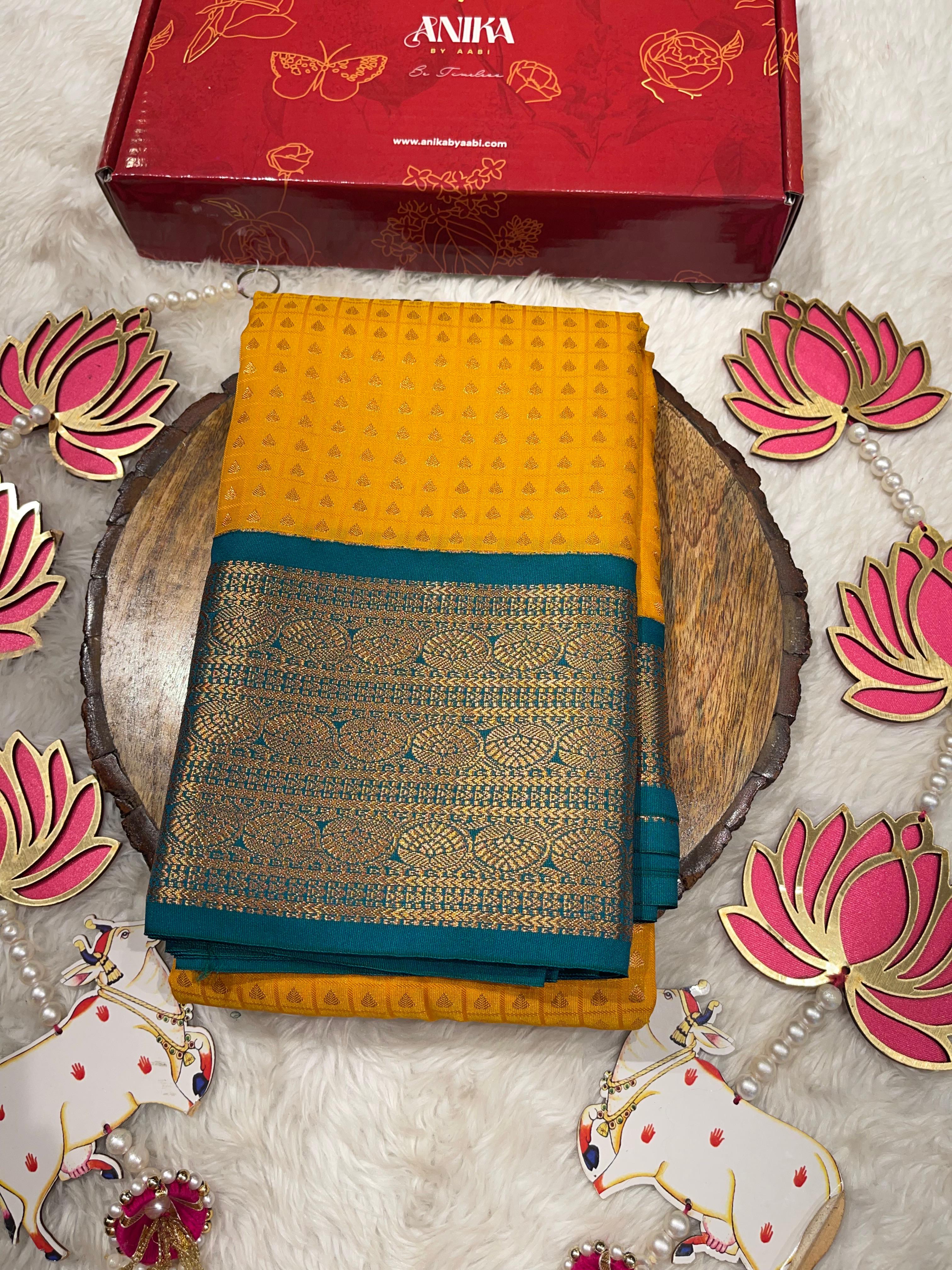 1000 BUTTAS-MANJAL WITH BOTTLEGREEN SAREE