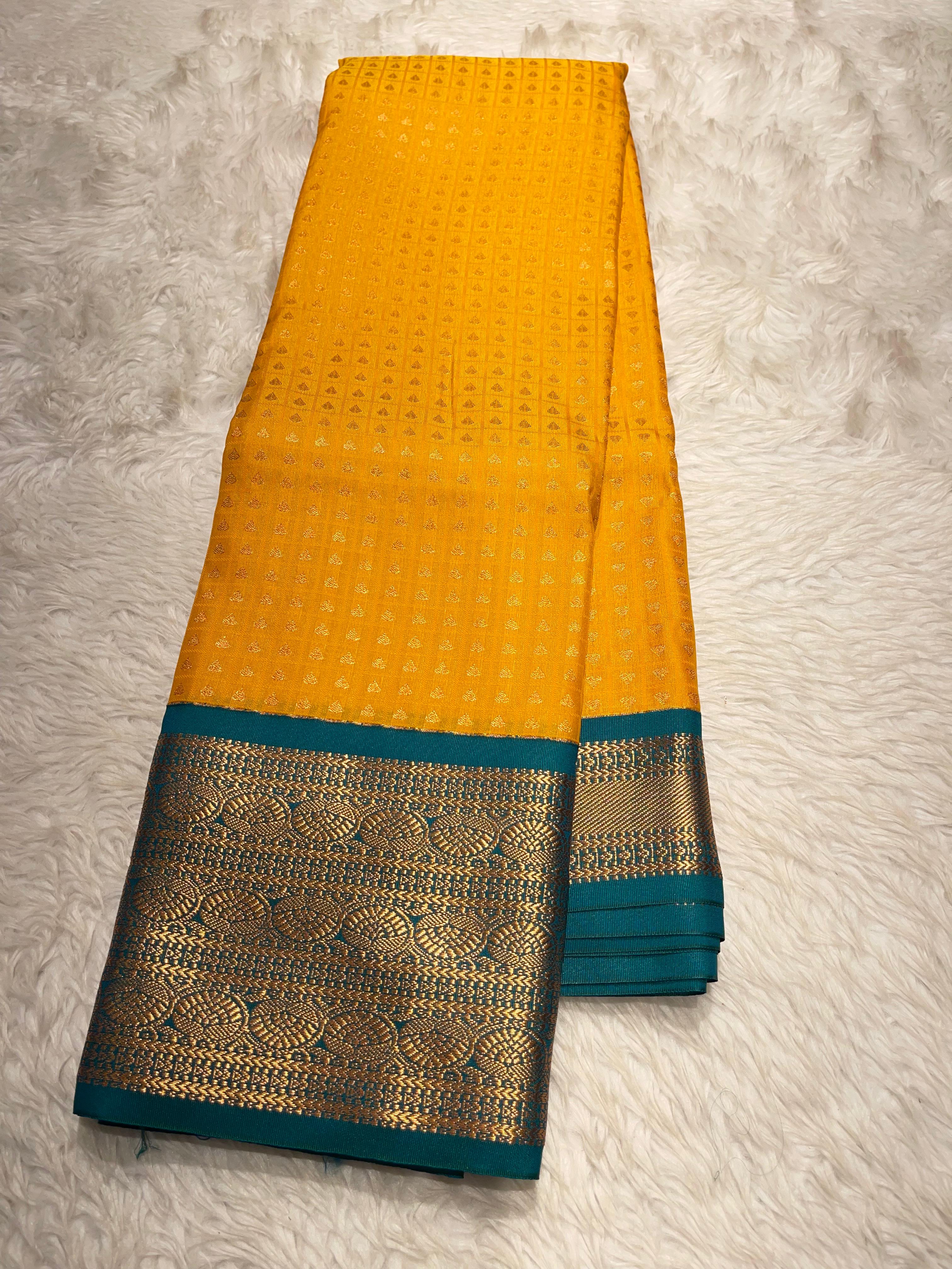 1000 BUTTAS-MANJAL WITH BOTTLEGREEN SAREE
