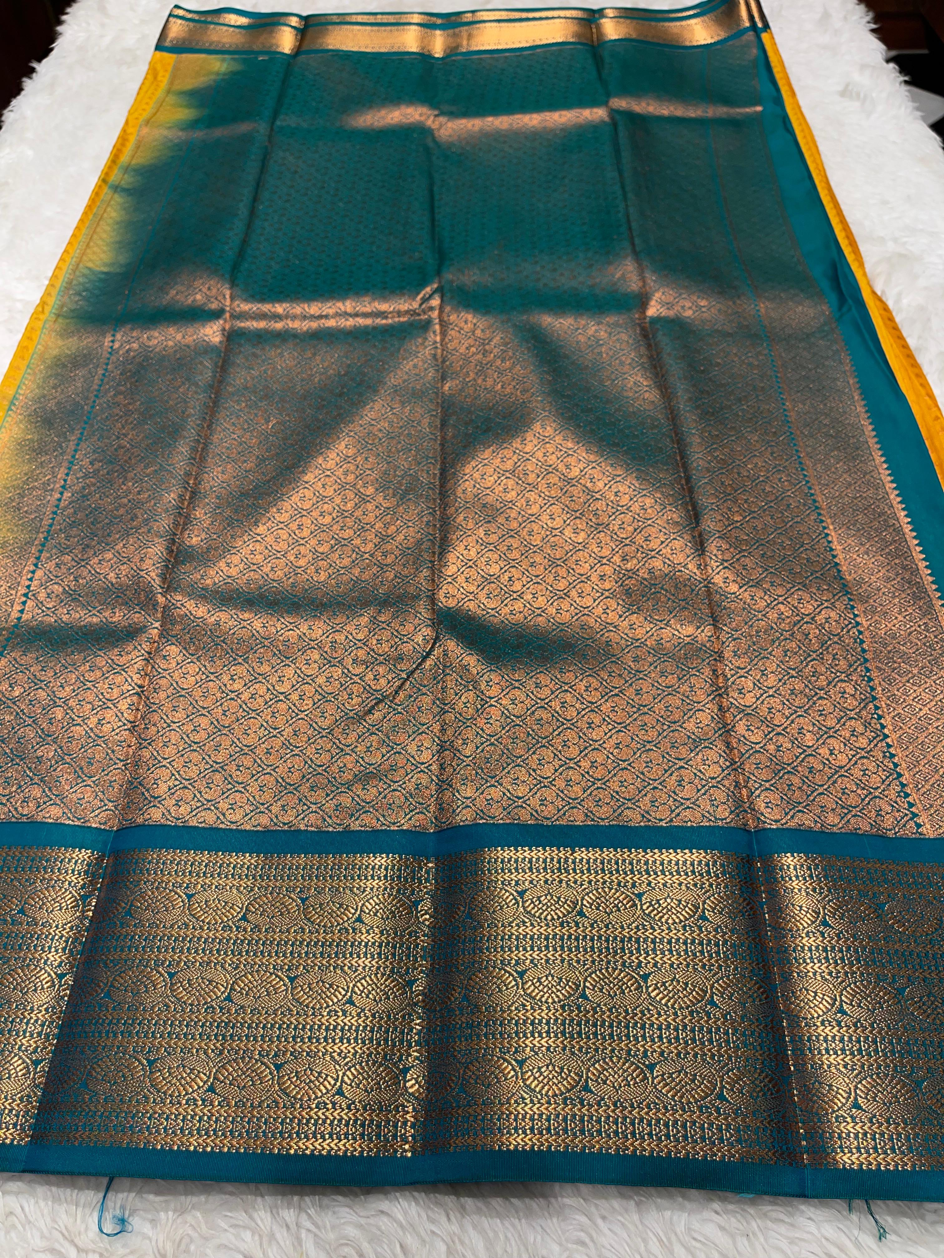 1000 BUTTAS-MANJAL WITH BOTTLEGREEN SAREE