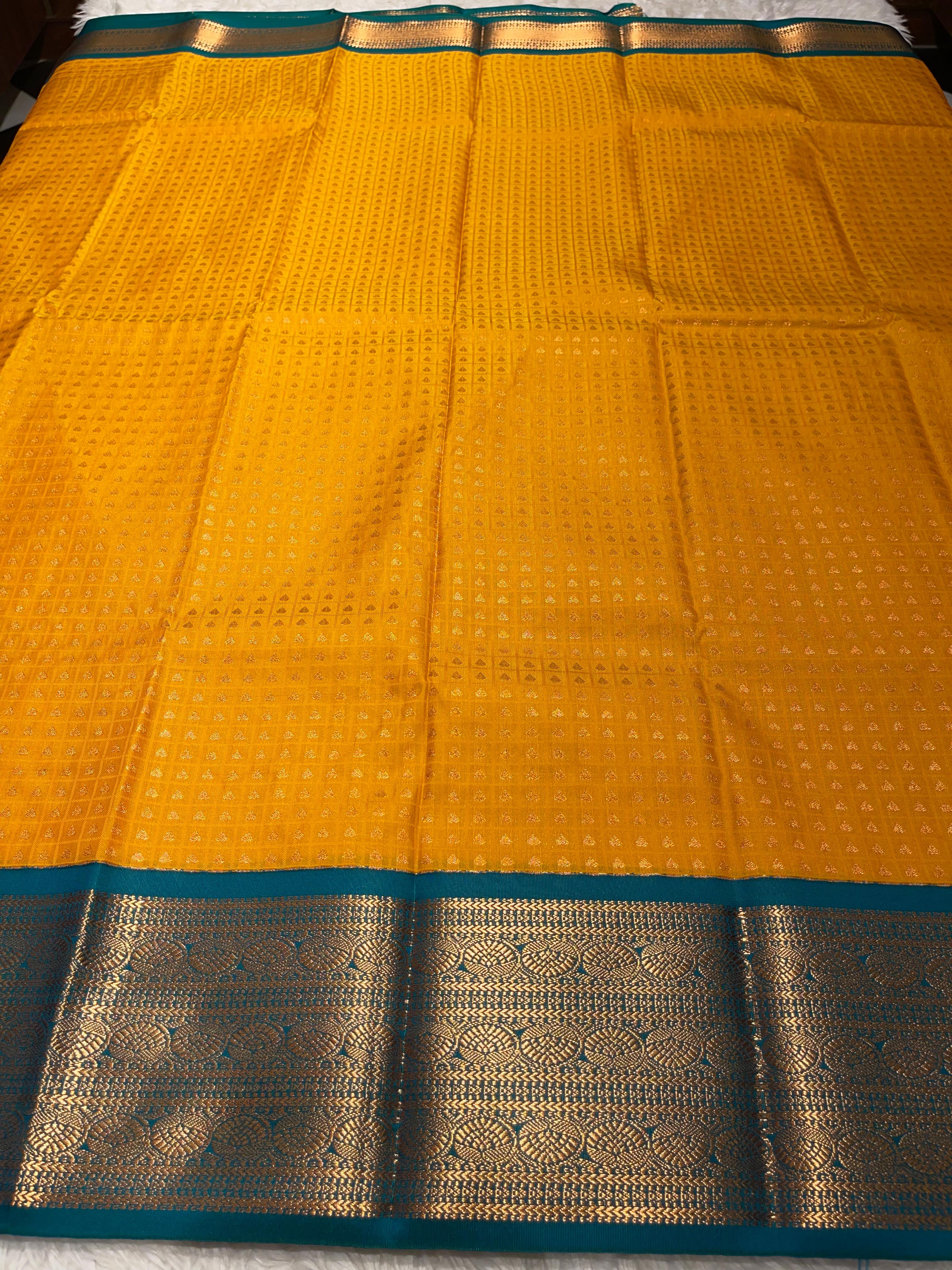 1000 BUTTAS-MANJAL WITH BOTTLEGREEN SAREE