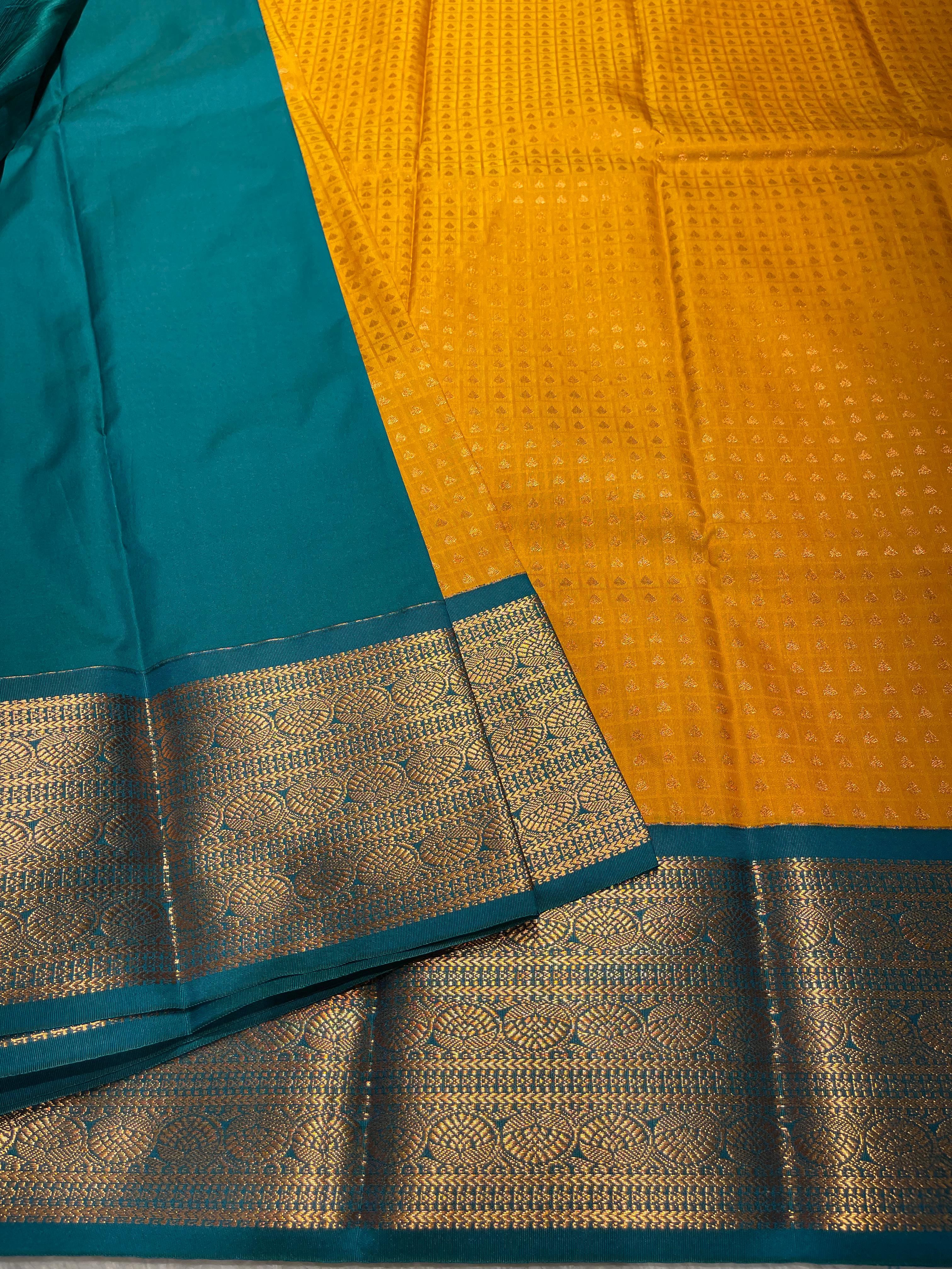 1000 BUTTAS-MANJAL WITH BOTTLEGREEN SAREE