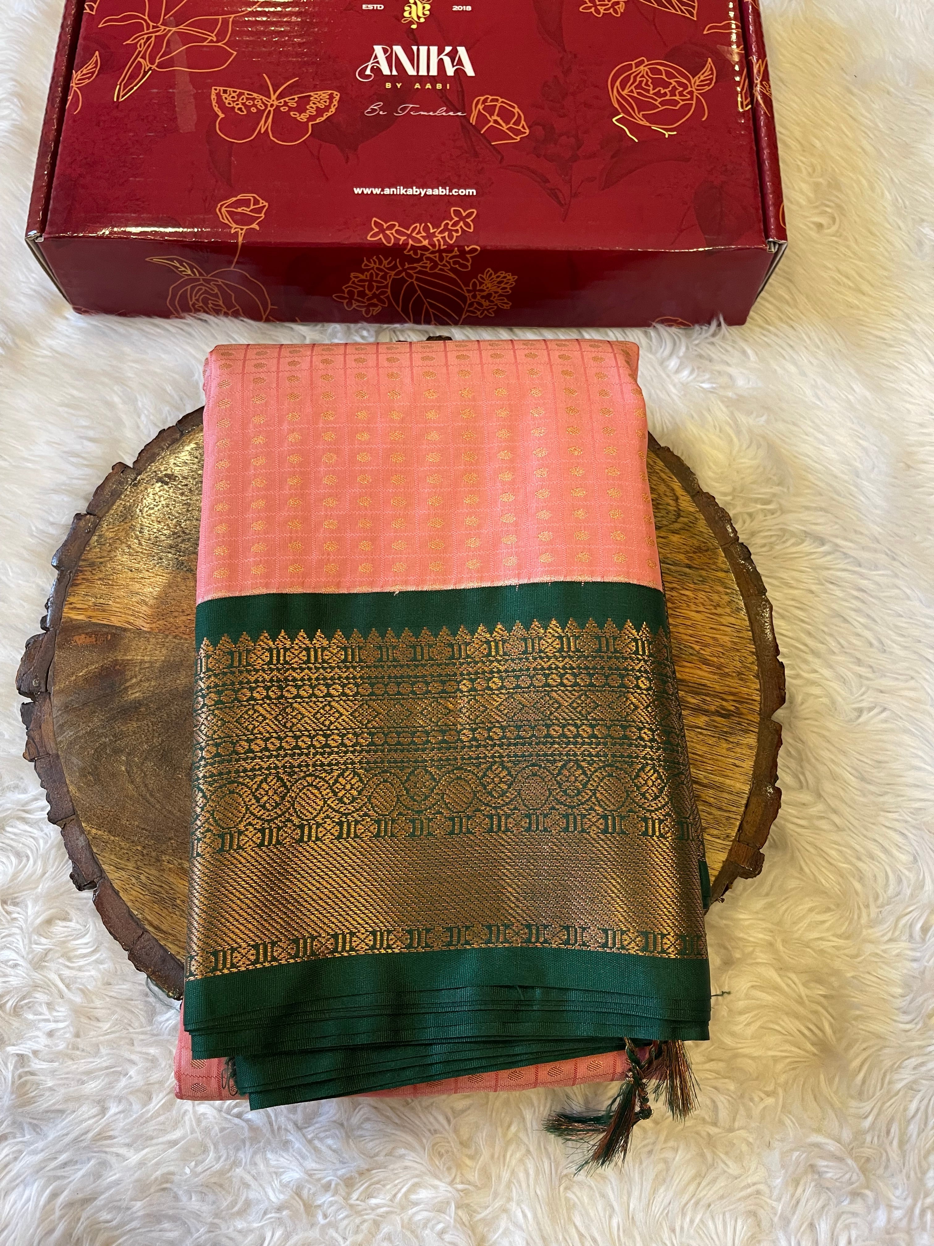 1000 BUTTAS-LIGHTPEACH WITH BOTTLEGREEN SAREE