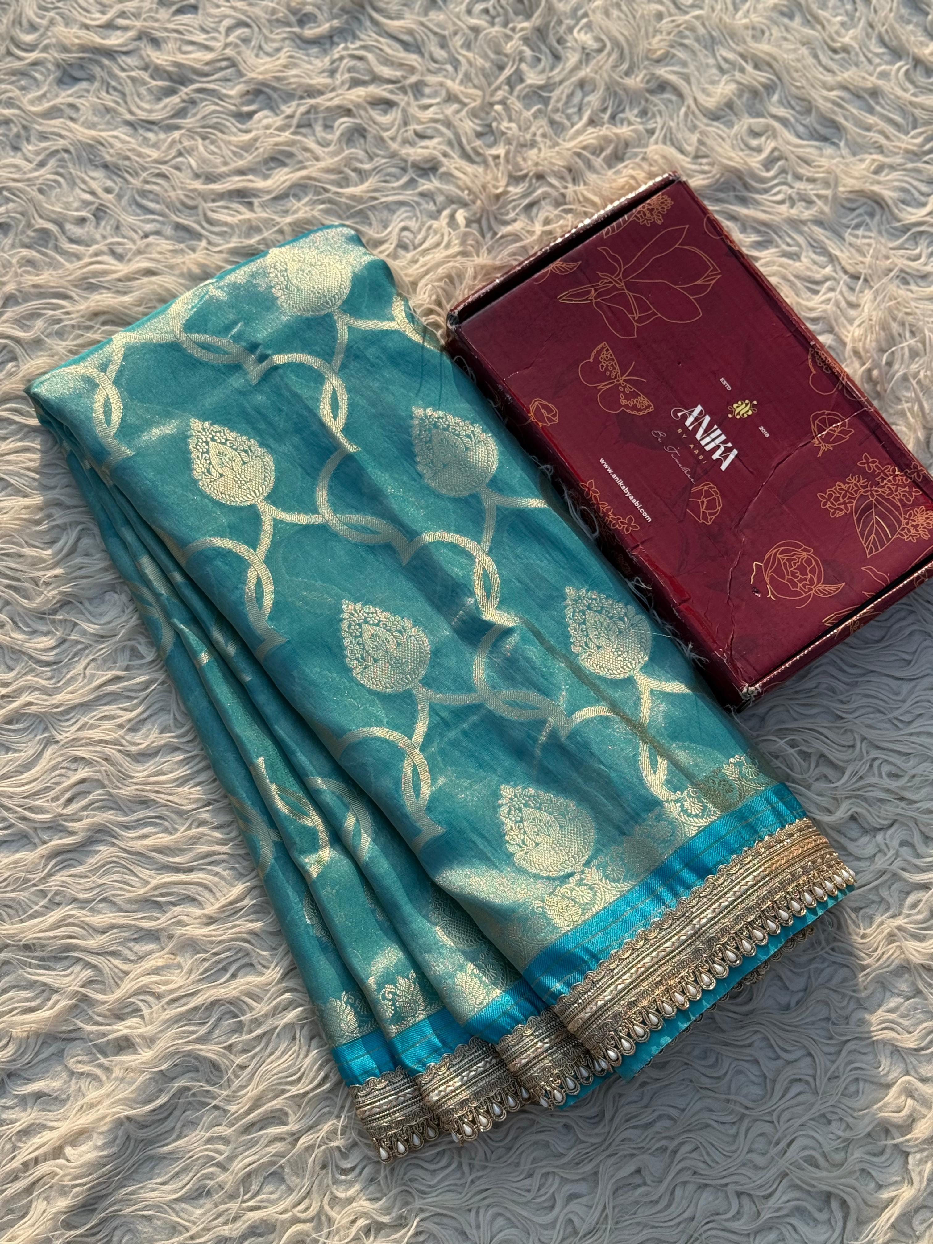 Anika's Tissue Motif saree - Blue